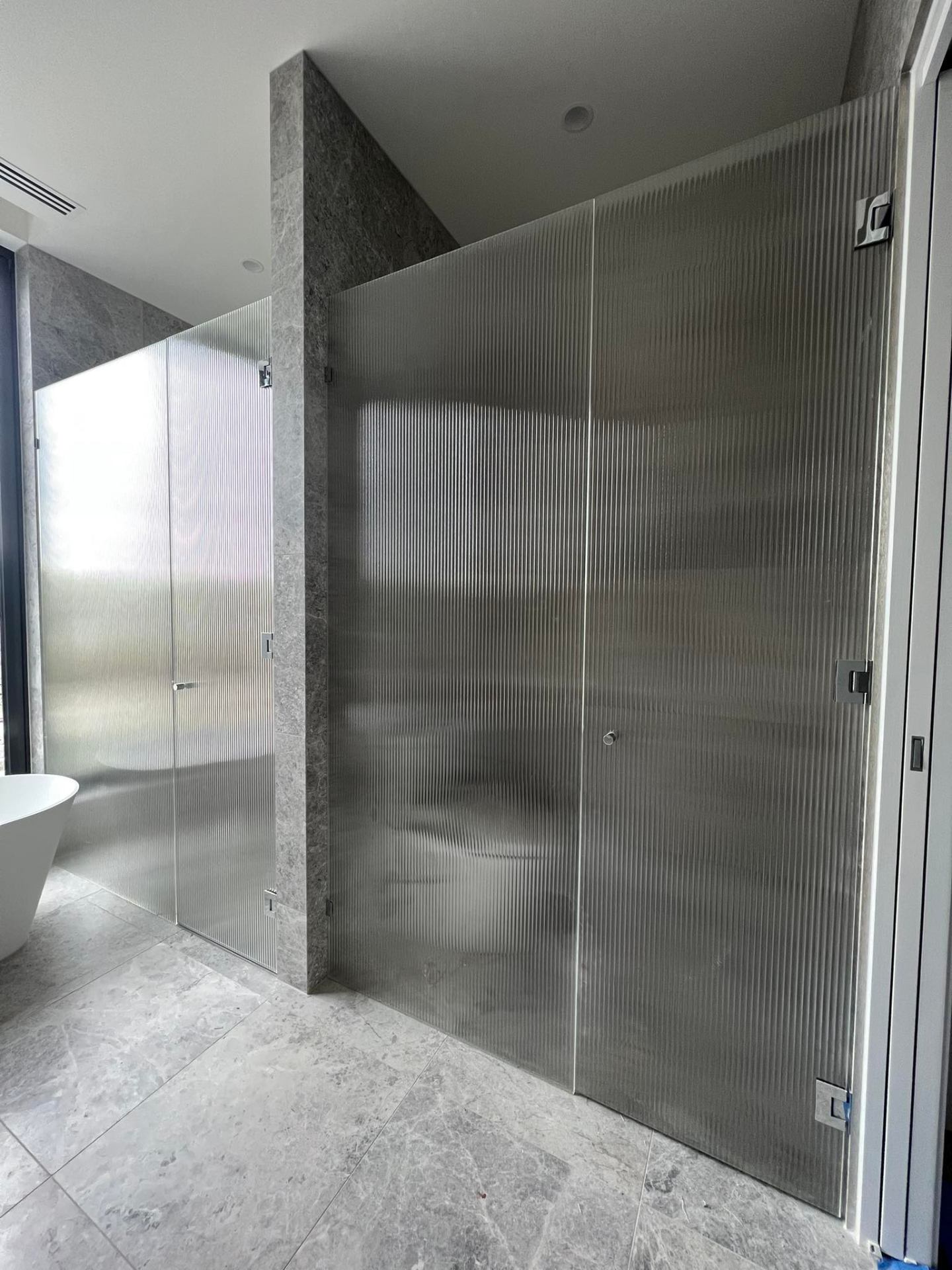 Fluted glass shower screen
