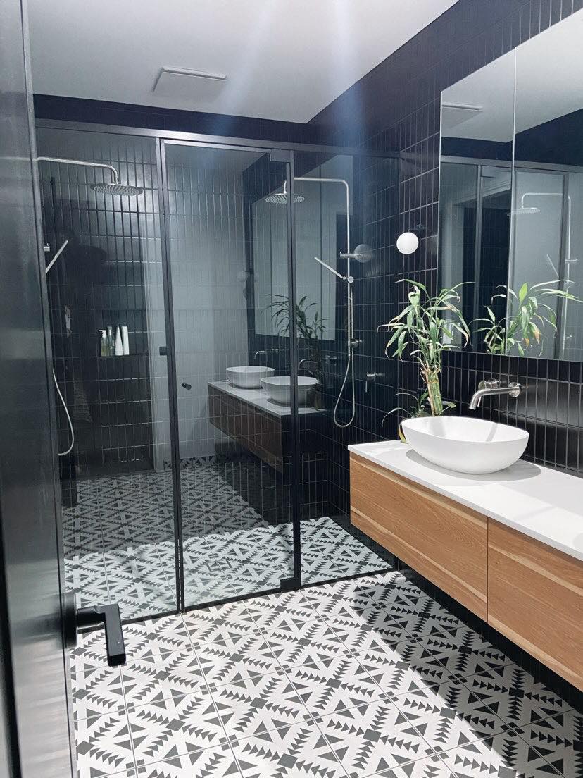 Black framed shower screen with clear toughened glass