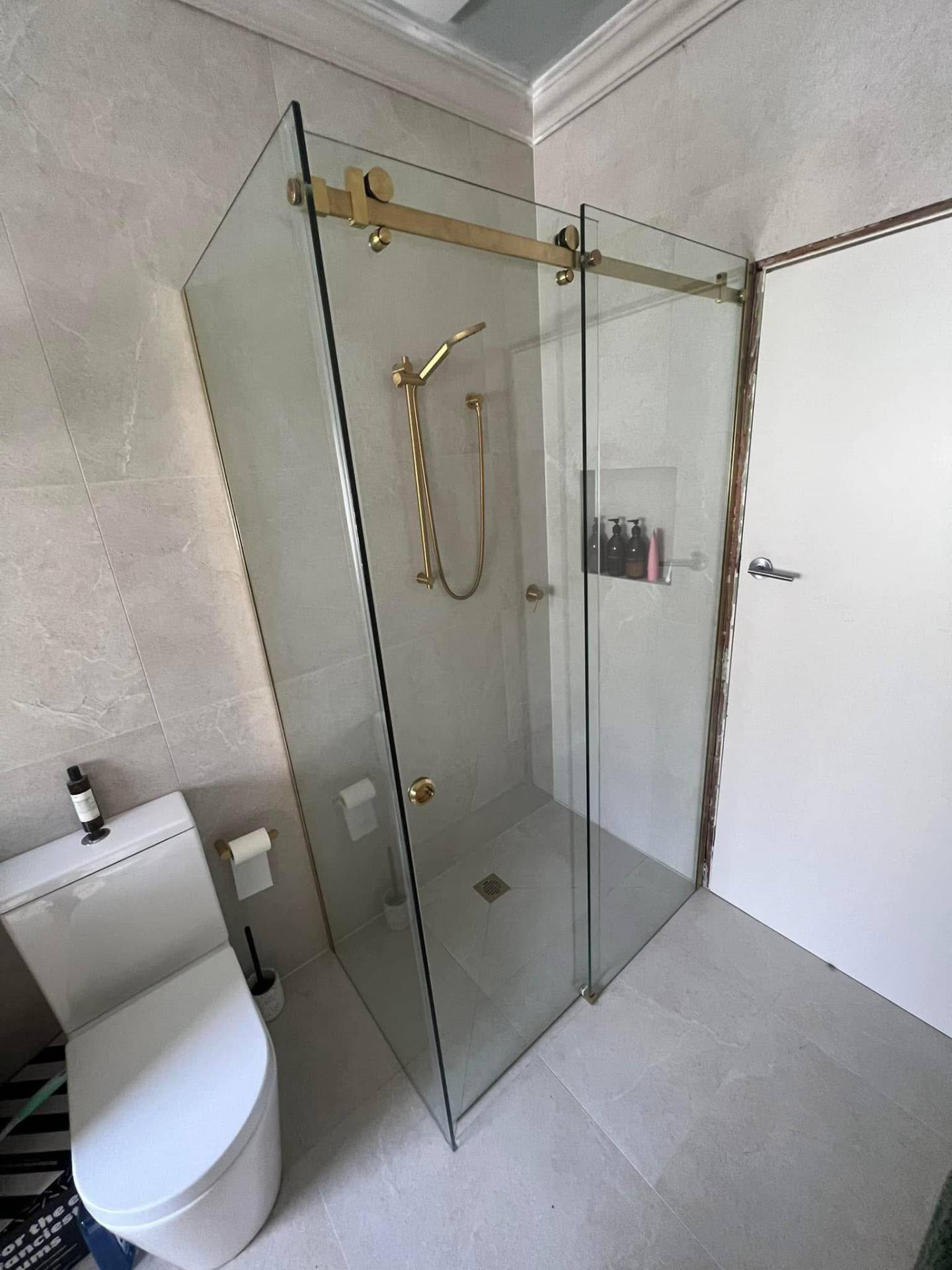 Gold hardware shower screen