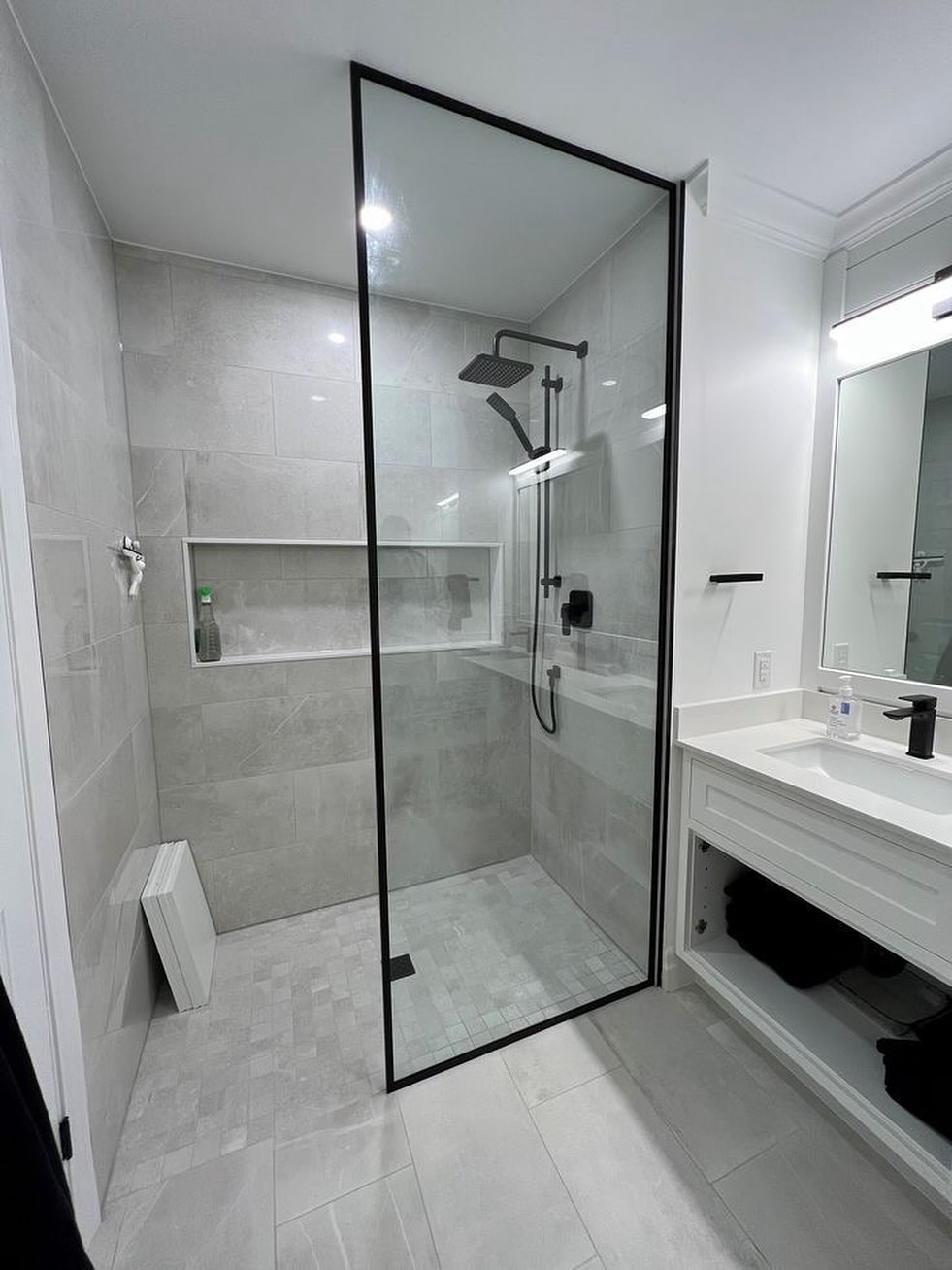 Black framed fixed shower panel